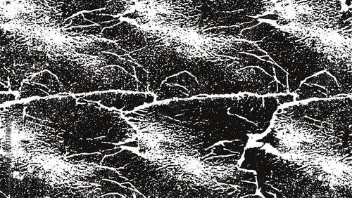 Cracked dry earth ground texture with deep fissures in arid desert environment