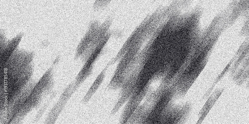 Abstract monochrome background with diagonal streaks of dark gray shadow and light gray noise creating a sense of movement and dynamic visual texture for creative projects