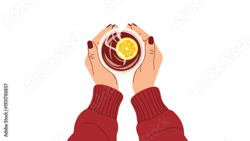 Top view of a person holding a hot cup of black tea with a fresh lemon slice in their hands while wearing a cozy red sweater.