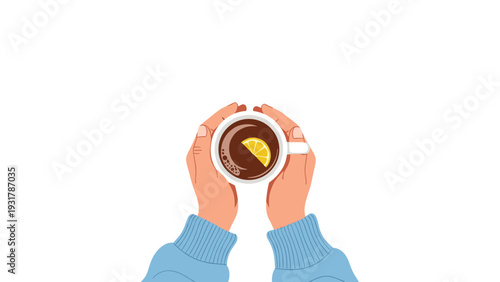 Person wearing a blue sweater holding a warm cup of dark tea with a fresh lemon slice from a top down perspective.