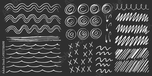 Collection of hand drawn white chalk lines and swirls on a black background