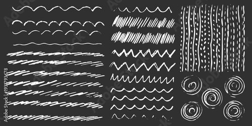 Collection of hand drawn chalk like lines and swirling patterns on black