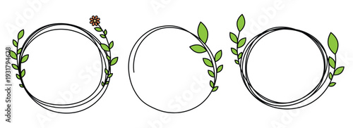 A set of three circular frames with green leaves