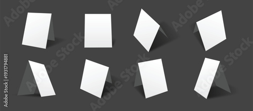 A group of white papers on a dark background