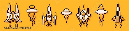 Collection with pixel spaceships and UFOs. 8-bit yellow and white elements.