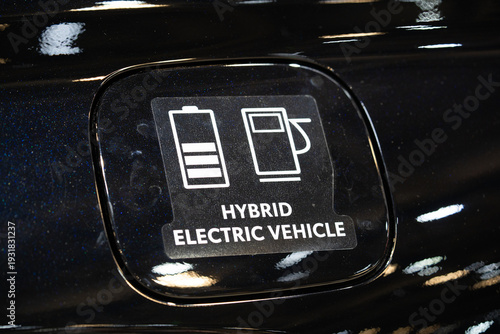 Photos Close up of hybrid electric vehicle badge on car body