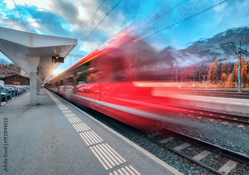Blurred red passenger train...