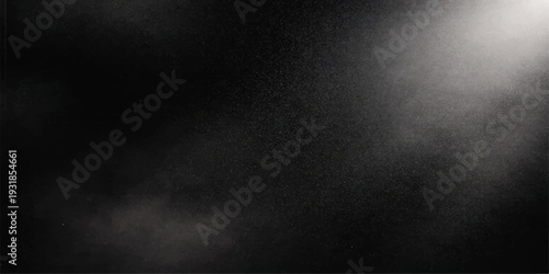 A dark grunge black concrete wall texture with a rough aged gray surface provides a vintage blank backdrop design for a dirty textured paper or chalkboard pattern