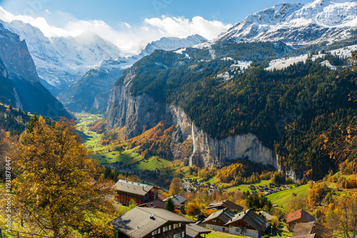 Lauterbrunnen valley aerial view from Wengen with autumn trees Staubbach Falls and snowy mountains. Wengen, Canton of Bern, Switzerland.