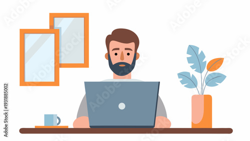 Bearded man working on laptop at modern desk with plant and frames
