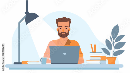 Bearded man working on laptop at desk with books and plant
