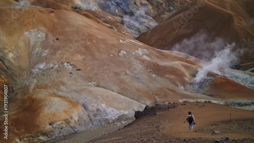 Hiker Descending into Geothermal Valley in Iceland