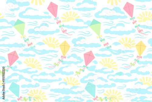 Kites fly against a bright sky with clouds and sun during a daytime outdoor event in a park