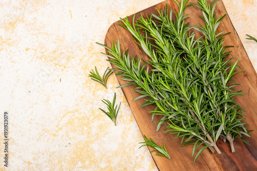 Rosemary branches on the old stone table background	