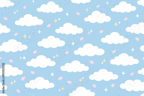 Bright clouds on a light blue sky with stars and petals at a sunny day