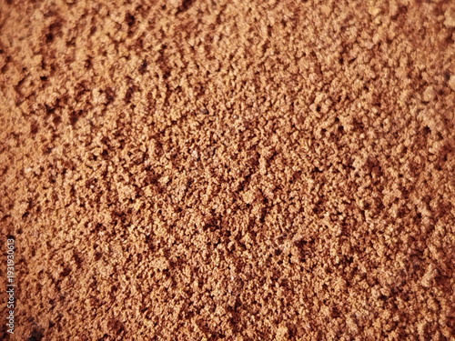 Textura de primer plano de polvo de cacao fino o café molido en tonos marrones