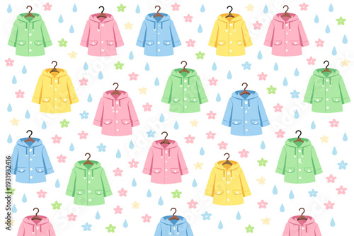 Colorful rain jackets hang on hooks in a playful pattern with flowers and raindrops in a bright design during spring time