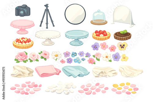Items for a dessert photo shoot with cakes, flowers, and props during a creative session in a studio