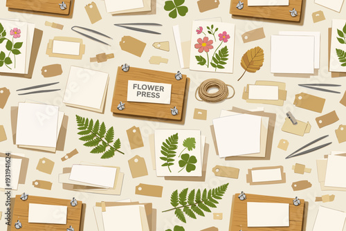 Crafting with pressed flowers and leaves in a creative workspace filled with tools, papers, and nature elements