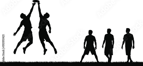 Silhouette of young men playing ultimate frisbee disc sports on grass field jumping to catch the flying disc during outdoor competition