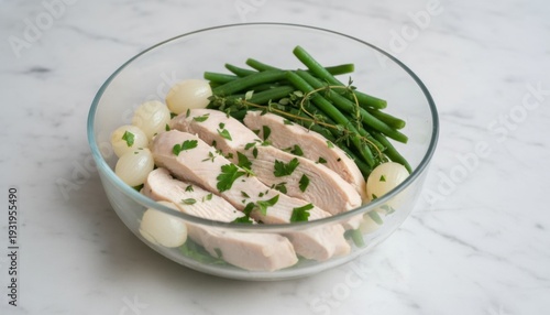 Tender Steamed Chicken Breast Slices with Green Beans and Pearl Onions in a Glass Bowl