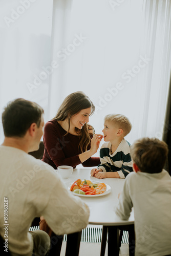 Family shares food and smil...