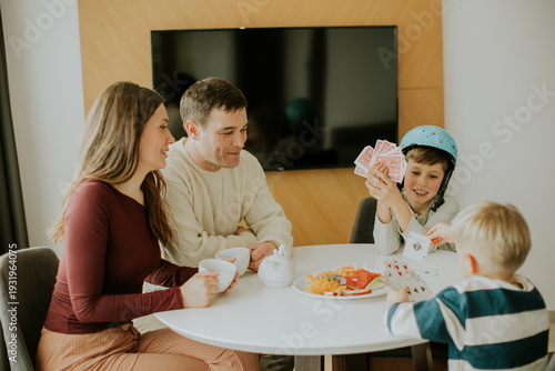Family enjoys tea and card ...