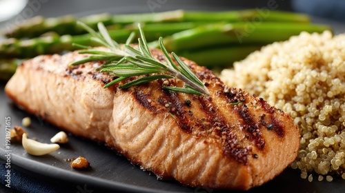 Freshly Grilled Salmon Fillet Seasoned With Rosemary and Served With Asparagus and Grains