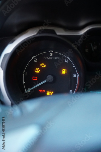 Obraz na płótnie Close-up of a car dashboard with multiple warning lights illuminated, including check engine, battery, and oil pressure icons, signifying mechanical trouble
