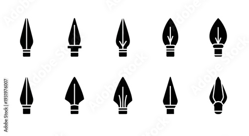 Collection of fountain pen nibs arranged in a grid pattern on a clean surface, viewed from directly above