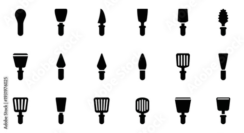 Collection of various makeup brushes displayed in a grid arrangement on a plain surface from a direct overhead viewpoint