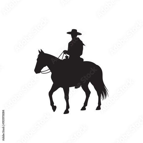 Silhouette of cowboy on horseback walking slowly in western landscape