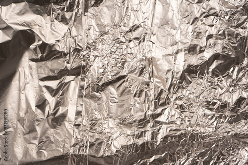 Shiny silver foil background. Top view.