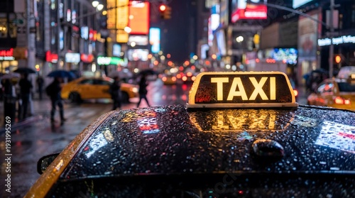 Wallpaper Mural On a rainy Manhattan evening, a taxi's luminous sign shines through water droplets on its surface, against a backdrop of blurred urban street lights, encapsulating a metropolitan city's vibrant Torontodigital.ca