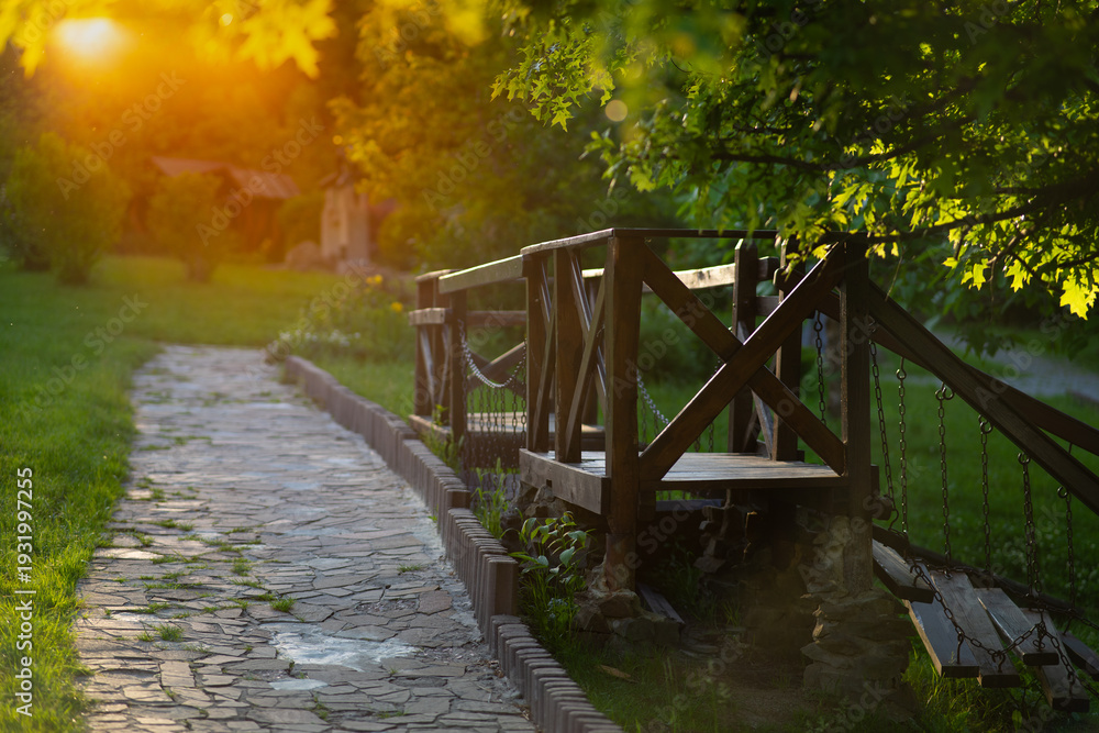 Obraz premium Dreamy Soft Focus Garden Path at Sunset. Golden Hour Nature Background