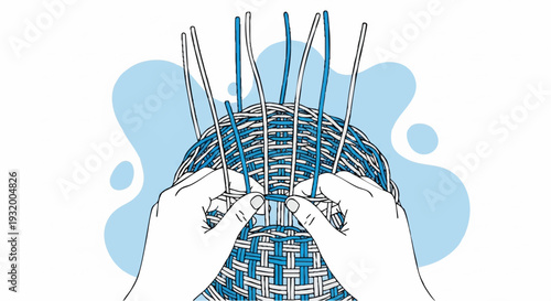 Hands weaving a basket with blue and white reeds.