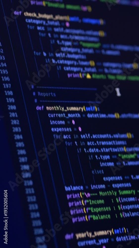 Source code displayed on monitor during vibe coding supported by ai assistant. Programming scene highlights artificial intelligence integration and structured software architecture workflow.