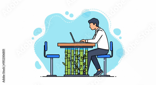 Man working on laptop at a desk with bamboo design.