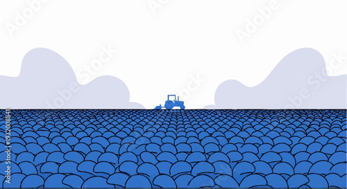 Tractor plowing a vast field under a cloudy sky.