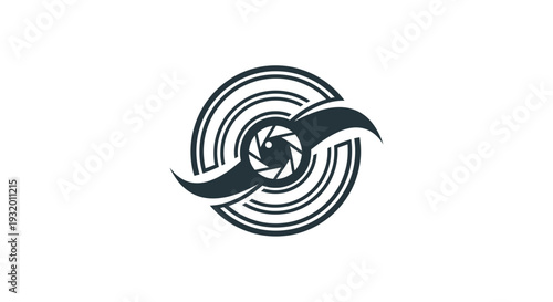 A circular emblem features a camera lens, with abstract wing-like elements on a white field