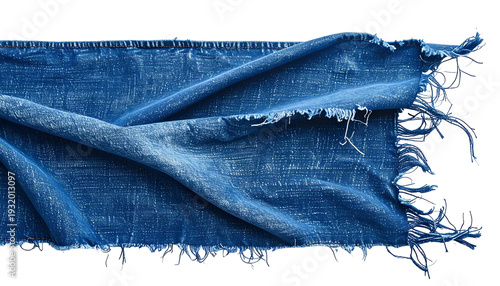 Close-up of vibrant indigo fabric with frayed edges, soft texture, folds, and natural dye effect