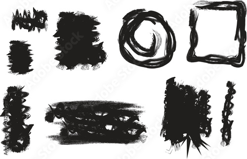 Collection of black brush strokes and smudges on a white background