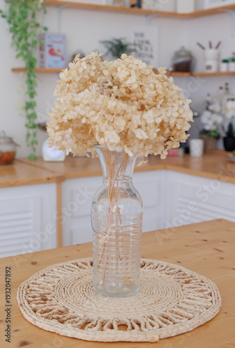 white flowers in a vase on a table