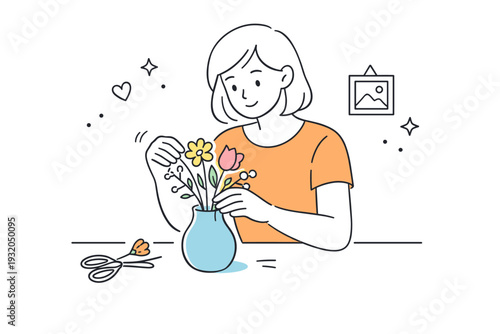 Women arranging flowers casually. A woman gently adjusts stems in a simple vase on a table, posture relaxed and unposed. Quiet creativity and everyday calm at