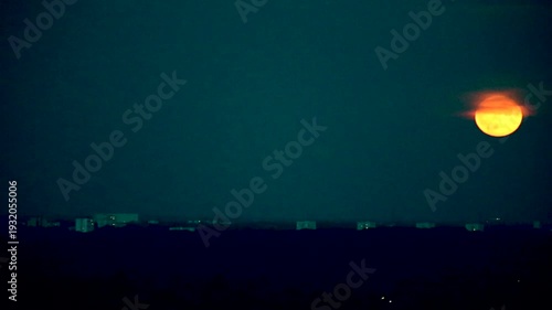 MeinSupermoon, large red moon rising over Hamburg, long tele lens shot Film