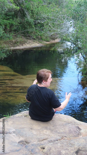 Woman sitting on the rocks