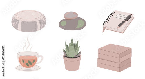 Charming collection of cozy home and office items including a decorative cushion, smooth stones, a notebook, steaming tea, a succulent plant, and stacked books.