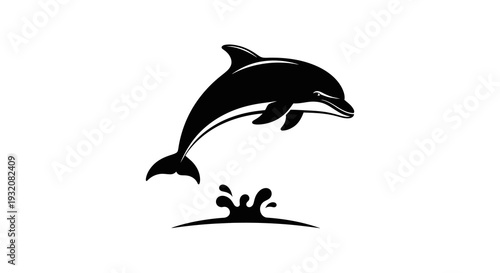 A sleek black silhouette of a dolphin leaping from ocean waves