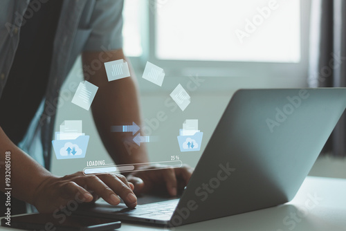 Man using cloud file transfer, data synchronization on laptop with upload, download interface. Online backup, document management, secure storage, digital workflow, network sharing technology concept.