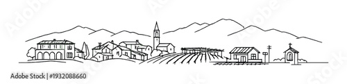 Village cluster with church tower and farmland beneath mountains